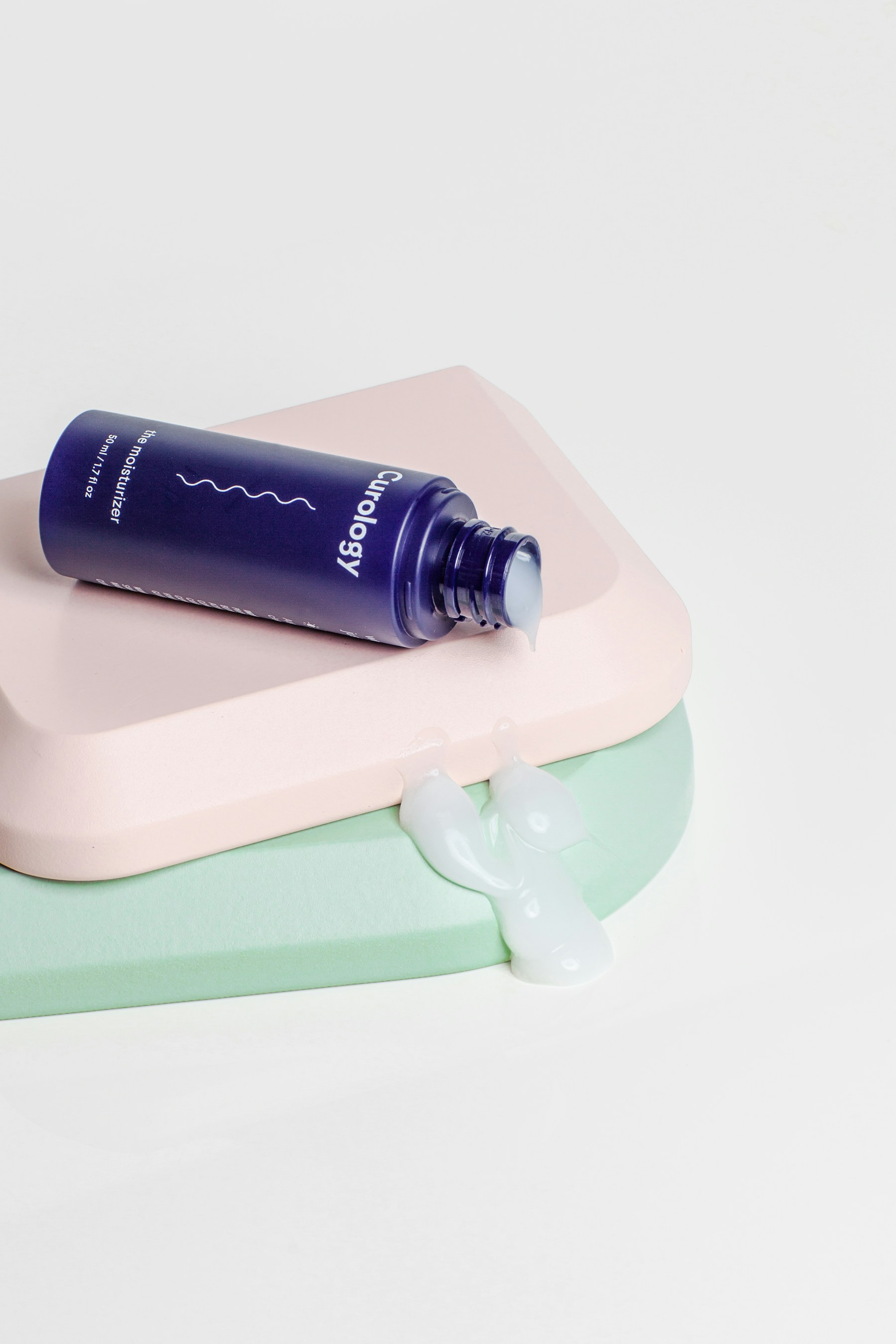 Skincare bottles arranged as a simple sequence.